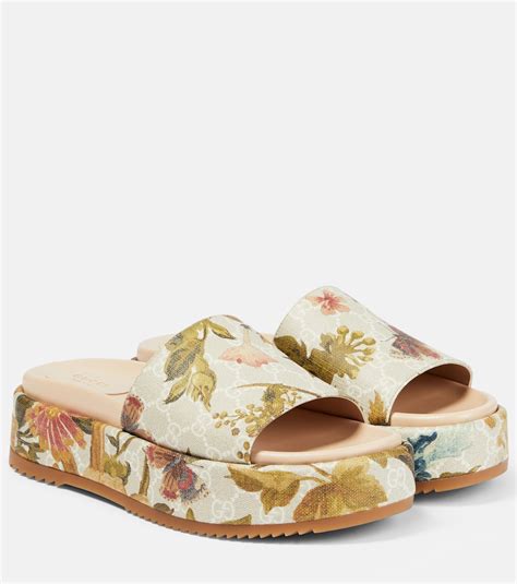 gucci flora slodes|Gucci floral platform slides.